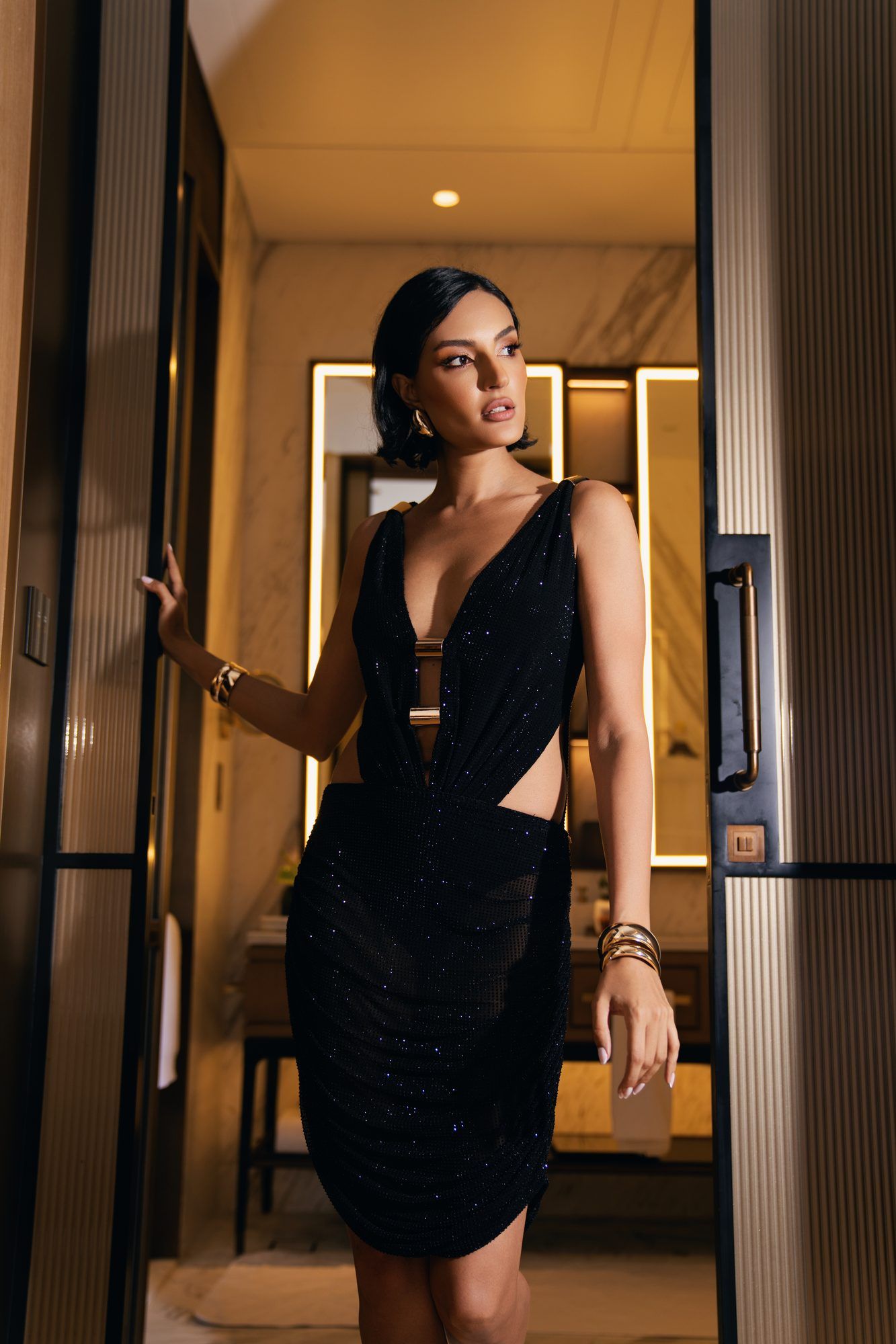 Model in a dark corridor in evening wear